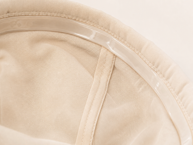 Close-up of OEKO-TEX certified bamboo fiber inner lining showing soft, natural texture